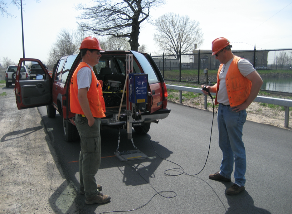 Figure 7. USGS hydrologists prepare equipment for a seismic imaging survey. The accelerated weight-drop energy source (blue box) is attached to the back of the vehicle. The survey was conducted as part of an applied research effort by the USGS Office of Groundwater Branch of Geophysics in the Bronx, New York, in 2007 (USGS, 2007).