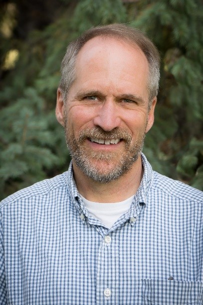 A photograph of Charlie DeWolf, Ph.D., P.G.