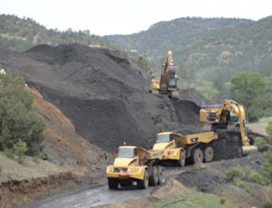Mine waste pile being moved offsite (Source: New Mexico Mining and Minerals Division)