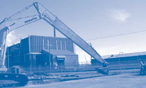 Figure 1. Construction of the extensive PRB trench at the East Helena site required use of a 50-foot-high excavator equipped with a long-reach arm and a 3-foot-wide bucket.