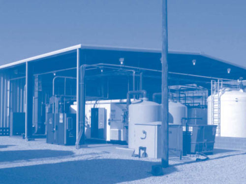 Figure 3. Cryogenic equipment, a  zeolite wheel concentrator, and LNAPL storage tanks are staged adjacent to the State Road 114 treatment plant.
