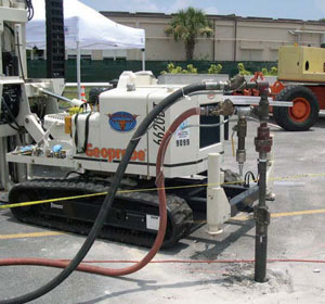 Pneumatic and product hoses attached to a 360ï¿½-rotatable injection nozzle on a direct push rig.