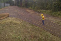 TRM strips approximately 6.5 feet wide deployed vertically along the outer portion of the berms surrounding impoundments 1 and 2 and anchored with metal pins prior to revegetation.