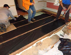Installation of high-density polyethylene sheets serving as vapor barriers in several homes near the Crossley Farm site.