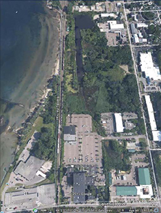 Figure 1. Aerial view of the 38-acre Pine Street Canal site, more than half of which is located in a 100-year-floodplain (primarily in vegetated areas).